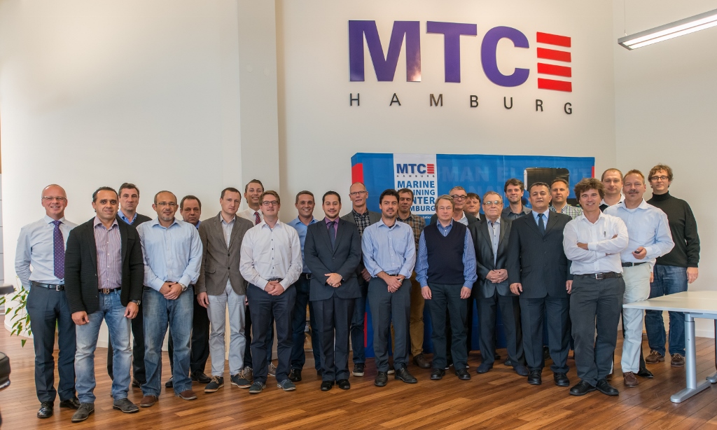 Group photo taken inside the MTC Hamburg office where the MRM Facilitator Training event took place.