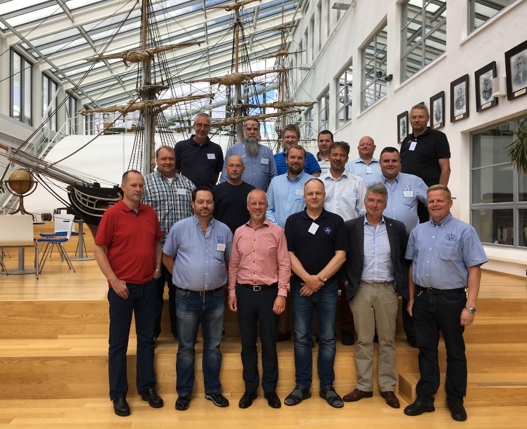 Participants pose during the MRM Kick-off event at Aboa Mare Academy and Training Centre. In the background is an old simulator where students have a hands-on training in raising the sails, setting the course, and a lot more seamanship skills.